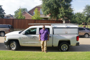 Tactical owner standing in front of vehicle